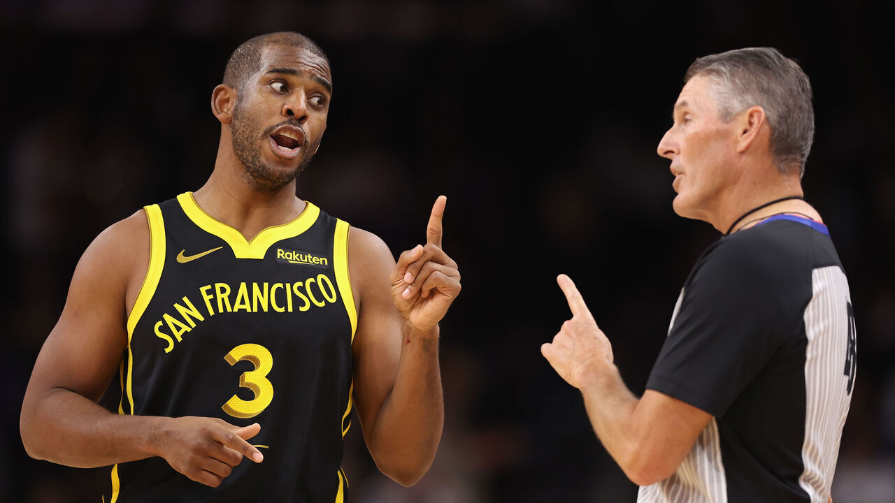 PHOENIX, ARIZONA - NOVEMBER 22: Chris Paul #3 of the Golden State Warriors reacts to referee Scott Foster #48 during the first half of the NBA game against the Phoenix Suns at Footprint Center on November 22, 2023 in Phoenix, Arizona.
