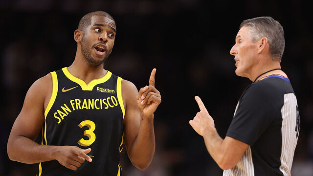 PHOENIX, ARIZONA - NOVEMBER 22: Chris Paul #3 of the Golden State Warriors reacts to referee Scott Foster #48 during the first half of the NBA game against the Phoenix Suns at Footprint Center on November 22, 2023 in Phoenix, Arizona.