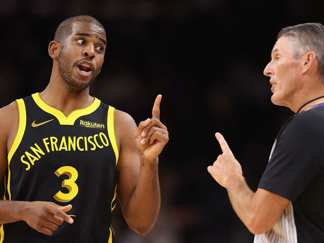 PHOENIX, ARIZONA - NOVEMBER 22: Chris Paul #3 of the Golden State Warriors reacts to referee Scott Foster #48 during the first half of the NBA game against the Phoenix Suns at Footprint Center on November 22, 2023 in Phoenix, Arizona.