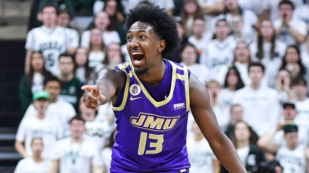 EAST LANSING, MI - NOVEMBER 06: James Madison Dukes guard Michael Green III (13) shouts to his teammates during a college basketball game between the Michigan State Spartans and James Madison Dukes on November 6, 2023 at Spartan Stadium in East Lansing, MI.