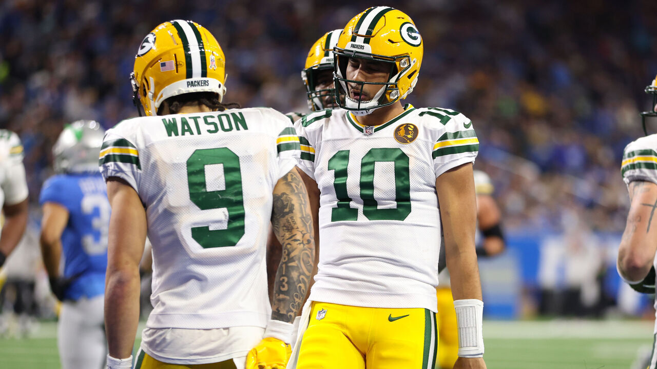 DETROIT, MICHIGAN - NOVEMBER 23: Christian Watson #9 of the Green Bay Packers celebrates with teammate Jordan Love #10 after scoring a touchdown against the Detroit Lions during the third quarter of the game at Ford Field on November 23, 2023 in Detroit, Michigan.