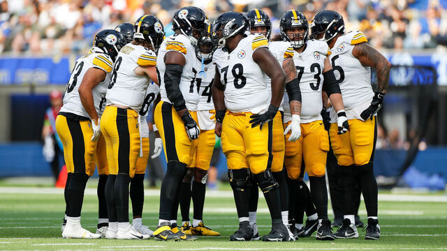 INGLEWOOD, CA - OCTOBER 22: The Pittsburgh Steelers offensive unit in a group huddle in the first quarter during an NFL regular season game between the Pittsburgh Steelers and the Los Angeles Rams on October 22, 2023, at SoFi Stadium in Inglewood, CA.