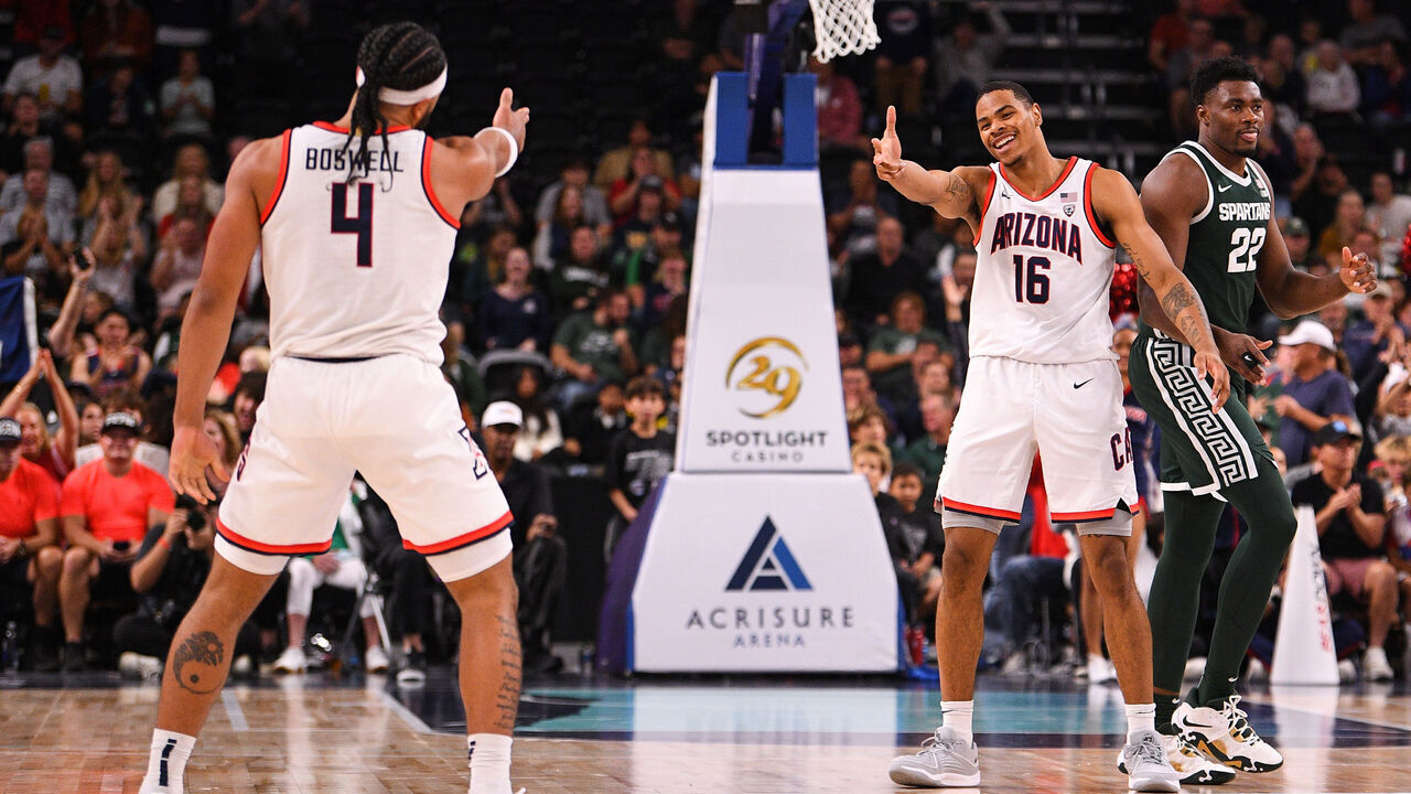 PALM DESERT, CA - NOVEMBER 23: Arizona Wildcats guard Kylan Boswell (4) celebrates with Arizona Wildcats forward Keshad Johnson (16) after he makes a shot during the Acrisure Invitational, a college basketball game, between the Arizona Wildcats and the Michigan State Spartans on November 23, 2023 at Acrisure Arena in Palm Springs, CA.