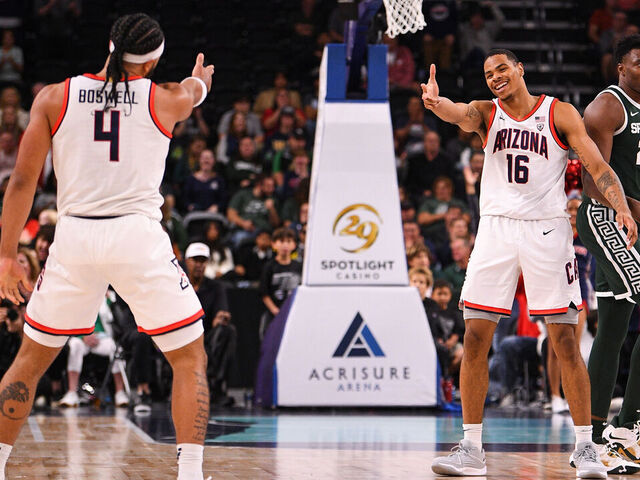 PALM DESERT, CA - NOVEMBER 23: Arizona Wildcats guard Kylan Boswell (4) celebrates with Arizona Wildcats forward Keshad Johnson (16) after he makes a shot during the Acrisure Invitational, a college basketball game, between the Arizona Wildcats and the Michigan State Spartans on November 23, 2023 at Acrisure Arena in Palm Springs, CA.