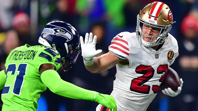 SEATTLE, WASHINGTON - NOVEMBER 23: Christian McCaffrey #23 of the San Francisco 49ers runs with the ball during the first quarter against the Seattle Seahawks at Lumen Field on November 23, 2023 in Seattle, Washington.