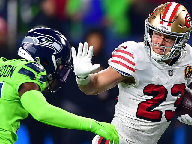 SEATTLE, WASHINGTON - NOVEMBER 23: Christian McCaffrey #23 of the San Francisco 49ers runs with the ball during the first quarter against the Seattle Seahawks at Lumen Field on November 23, 2023 in Seattle, Washington.