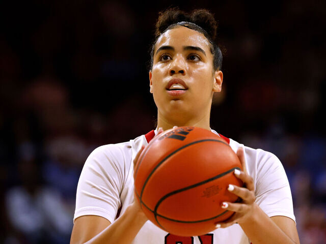 RALEIGH, NC - FEBRUARY 16: Madison Hayes #21 of the NC State Wolfpack prepares to shoot a free throw against the North Carolina Tar Heels at Reynolds Coliseum on February 16, 2023 in Raleigh, North Carolina. NC State won 77-66 in OT.