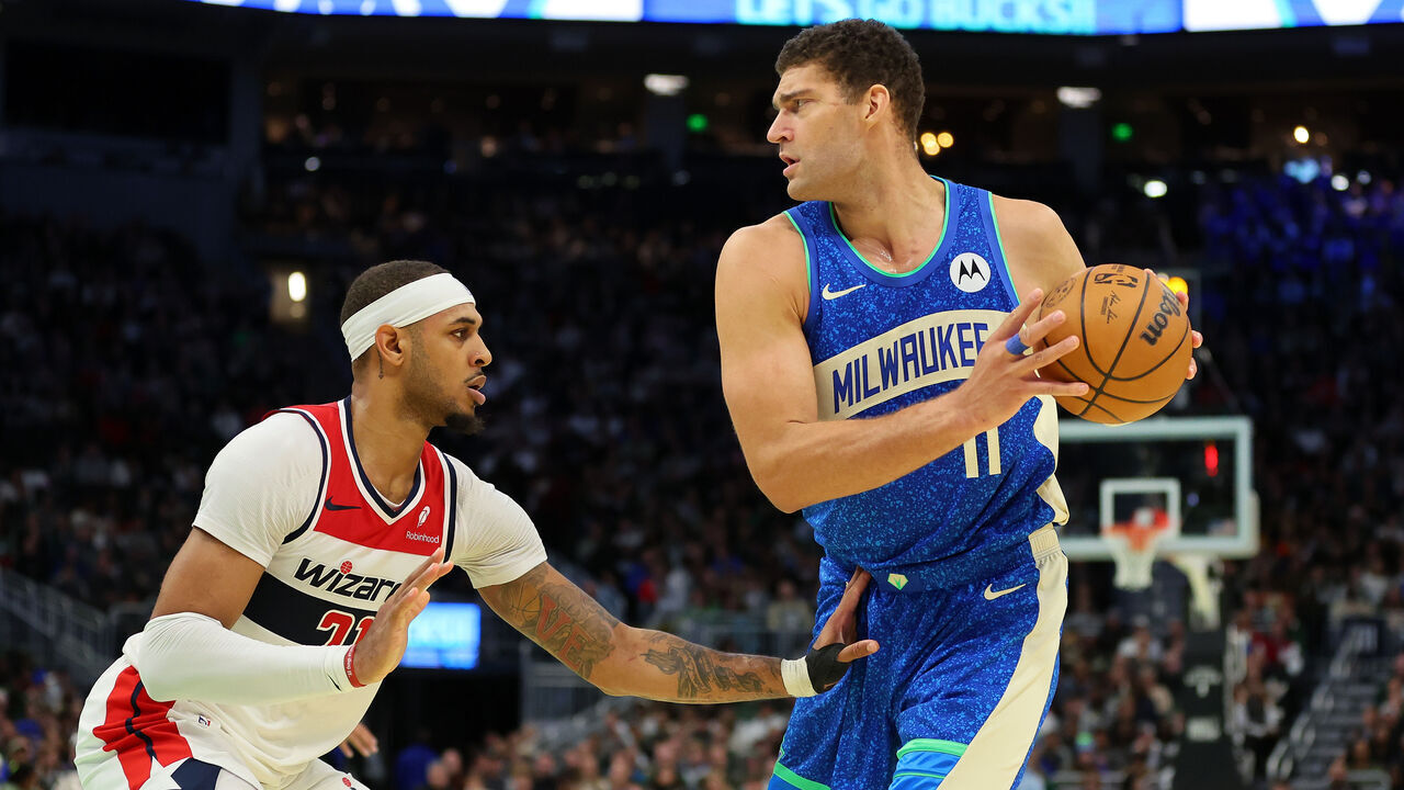 MILWAUKEE, WISCONSIN - NOVEMBER 24: Brook Lopez #11 of the Milwaukee Bucks is defended by Daniel Gafford #21 of the Washington Wizards during the second half of an In-Season Tournament game at Fiserv Forum on November 24, 2023 in Milwaukee, Wisconsin.