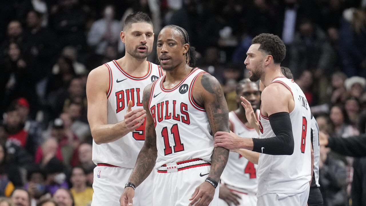 TORONTO, ON - NOVEMBER 24: DeMar DeRozan #11 of the Chicago Bulls reacts at the end of the second half with teammates Nikola Vucevic #9 (L) and Zach LaVine #8 (R) in the NBA In-Season Tournament game against the Toronto Raptors at the Scotiabank Arena on November 24, 2023 in Toronto, Ontario, Canada. NOTE TO USER: User expressly acknowledges and agrees that, by downloading and/or using this Photograph, user is consenting to the terms and conditions of the Getty Images License Agreement.