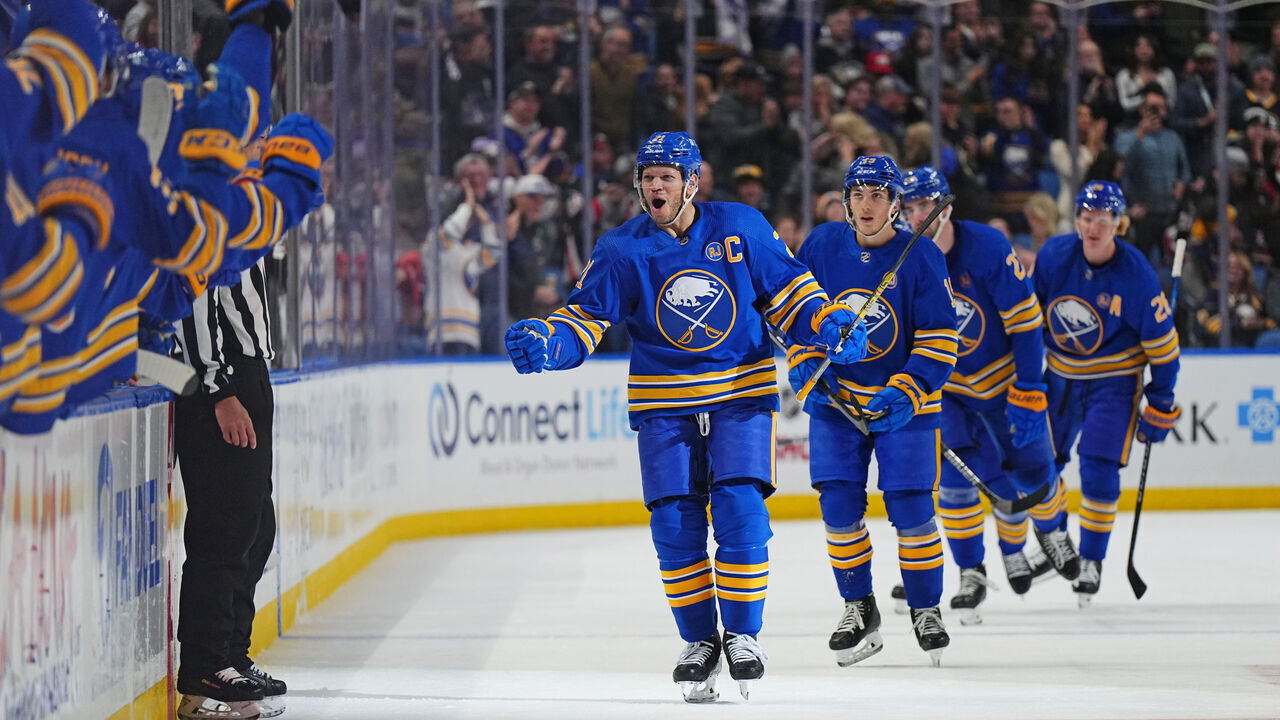 BUFFALO, NEW YORK - NOVEMBER 24: Kyle Okposo #21 of the Buffalo Sabres heads to the bench to celebrate his third period goal against the Pittsburgh Penguins during an NHL game on November 24, 2023 at KeyBank Center in Buffalo, New York.