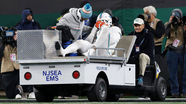 EAST RUTHERFORD, NEW JERSEY - NOVEMBER 24: Jaelan Phillips #15 of the Miami Dolphins is carted off the field after being injured in a play against the New York Jets during the fourth quarter in the game at MetLife Stadium on November 24, 2023 in East Rutherford, New Jersey.