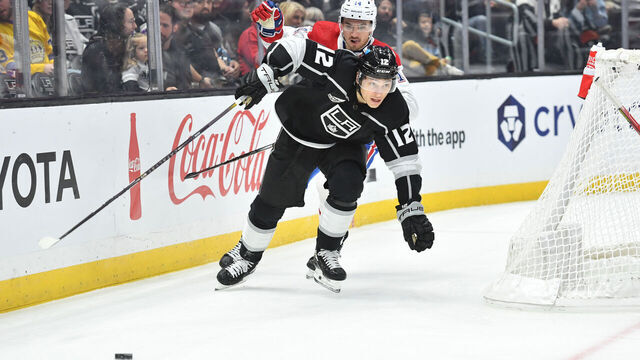 LOS ANGELES, CA - NOVEMBER 25: Trevor Moore #12 of the Los Angeles Kings skates towards puck during the first period against the Montreal Canadiens at Crypto.com Arena on November 25, 2023 in Los Angeles, California.