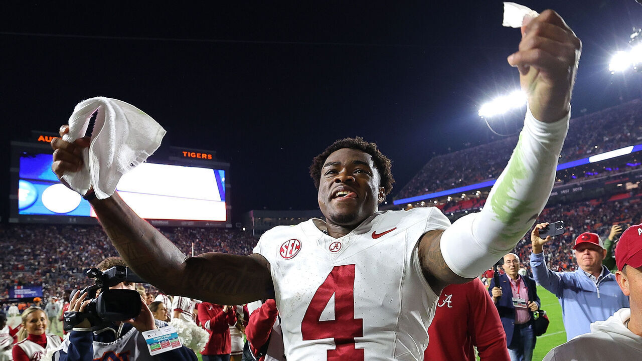 AUBURN, ALABAMA - NOVEMBER 25: Jalen Milroe #4 of the Alabama Crimson Tide celebrates their 27-24 win over the Auburn Tigers at Jordan-Hare Stadium on November 25, 2023 in Auburn, Alabama.
