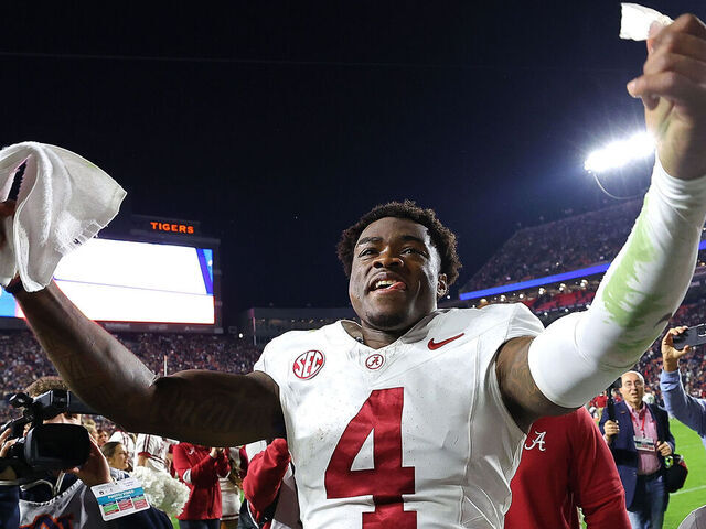 AUBURN, ALABAMA - NOVEMBER 25: Jalen Milroe #4 of the Alabama Crimson Tide celebrates their 27-24 win over the Auburn Tigers at Jordan-Hare Stadium on November 25, 2023 in Auburn, Alabama.