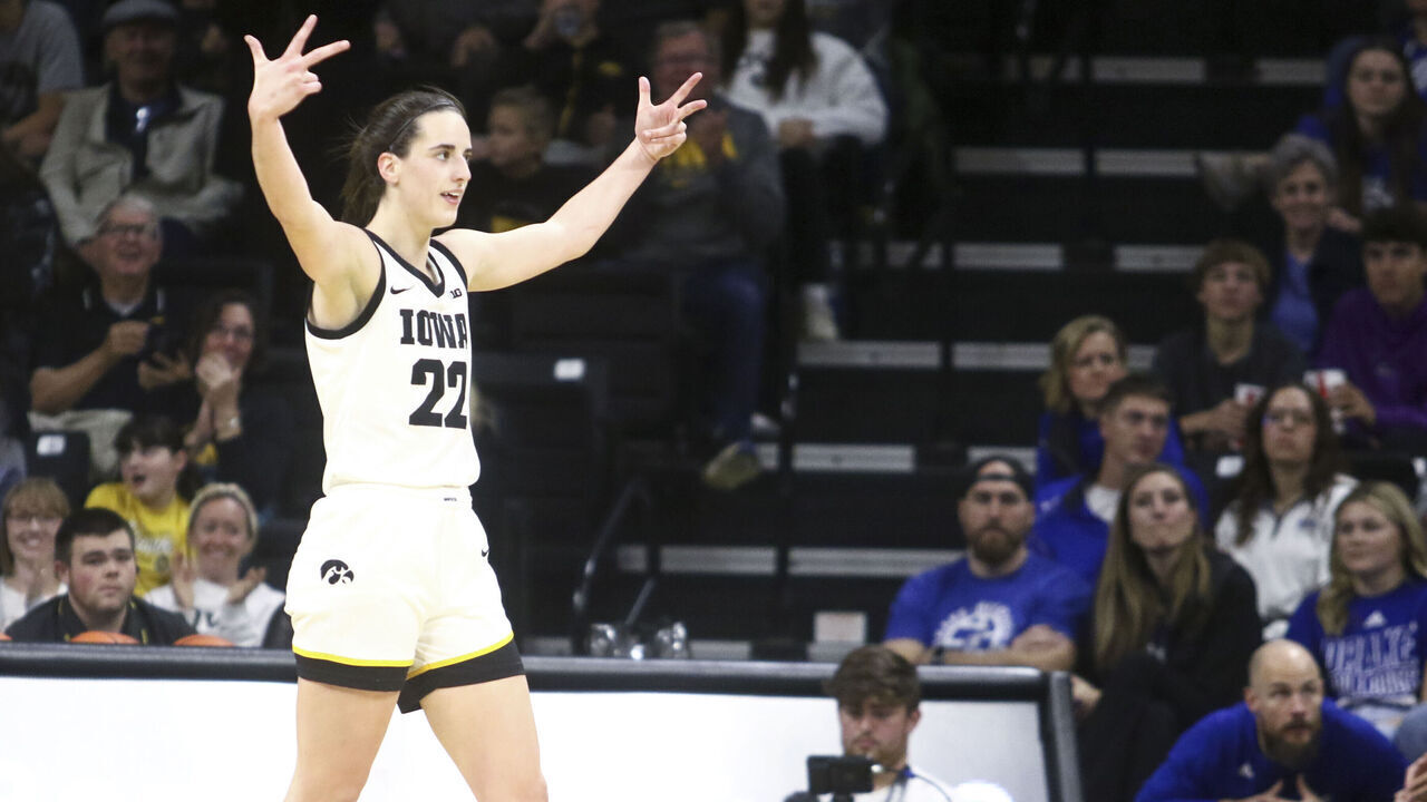 IOWA CITY, IOWA- NOVEMBER 19: Guard Caitlin Clark #22 of the Iowa Hawkeyes gestures to the crowd after a basket during the second half against the Drake Bulldogs at Carver-Hawkeye Arena on November 19, 2023 in Iowa City, Iowa.