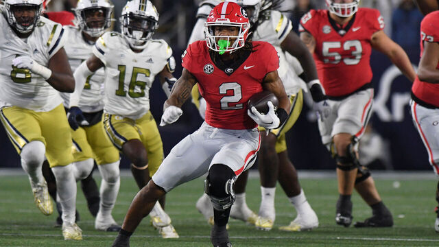 ATLANTA, GA - NOVEMBER 25: Georgia Bulldogs Running Back Kendall Milton (2) rushes the ball during the college football game between the Georgia Bulldogs and the Georgia Tech Yellow Jackets on November 25, 2023, at Bobby Dodd Stadium in Atlanta, GA.