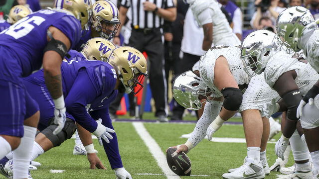 SEATTLE, WA - OCTOBER 14: Offensive and defense players get set during a college football game between the Washington Huskies and the Oregon Ducks on October 14, 2023 at Husky Stadium in Seattle, WA.