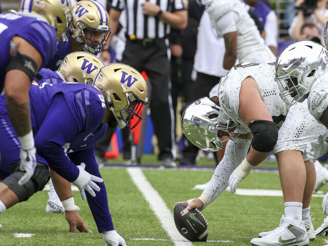 SEATTLE, WA - OCTOBER 14: Offensive and defense players get set during a college football game between the Washington Huskies and the Oregon Ducks on October 14, 2023 at Husky Stadium in Seattle, WA.