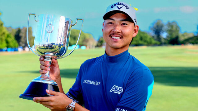 Min Woo Lee of Australia poses with his trophy following victory on the final day of the Australian PGA Championship at the Royal Queensland Golf Club in Brisbane on November 26, 2023.