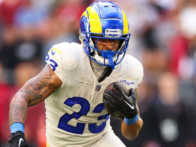 GLENDALE, ARIZONA - NOVEMBER 26: Kyren Williams #23 of the Los Angeles Rams runs the ball during the first quarter against the Arizona Cardinals at State Farm Stadium on November 26, 2023 in Glendale, Arizona.