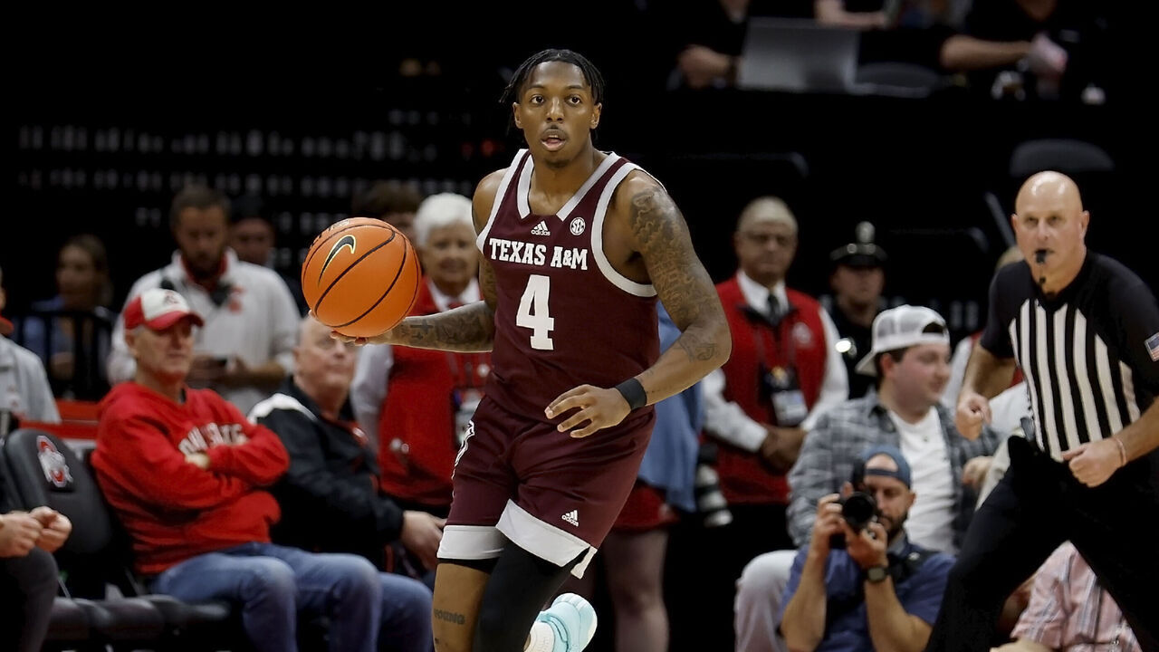 COLUMBUS, OHIO - NOVEMBER 10: Wade Taylor IV #4 of the Texas A&M Aggies controls the ball during the game against the Ohio State Buckeyes at Value City Arena on November 10, 2023 in Columbus, Ohio. Texas A&M defeated Ohio state 73-66.