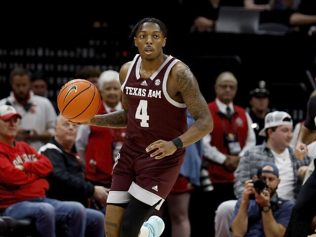 COLUMBUS, OHIO - NOVEMBER 10: Wade Taylor IV #4 of the Texas A&M Aggies controls the ball during the game against the Ohio State Buckeyes at Value City Arena on November 10, 2023 in Columbus, Ohio. Texas A&M defeated Ohio state 73-66.