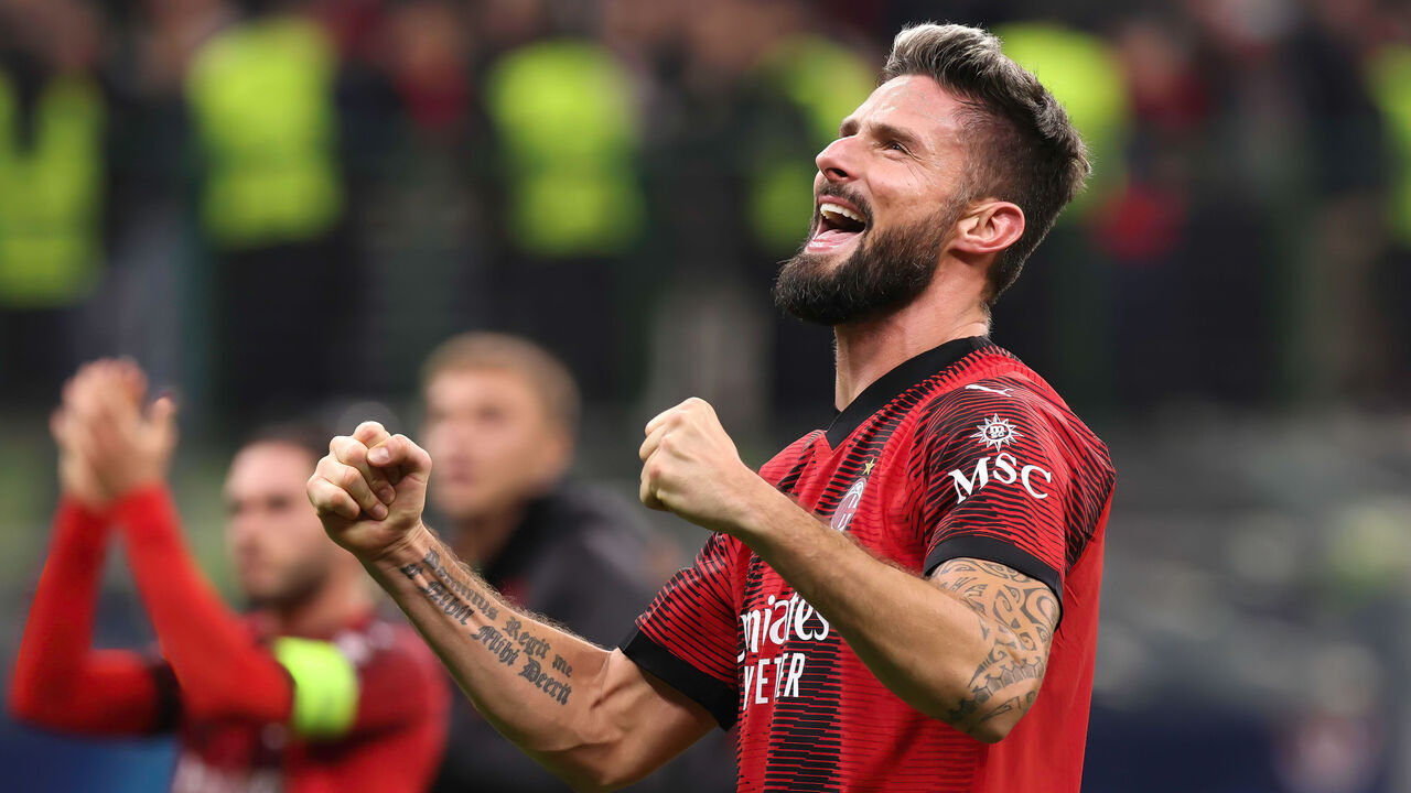 MILAN, ITALY - 2023/11/08: Olivier Giroud (AC Milan) celebrates the victory and greets the fans in the stands at the end of the soccer game AC Milan vs PSG - Champions League 2023/2024 Group F match day 4 at San Siro Stadium. AC Milan wins 2-1.
