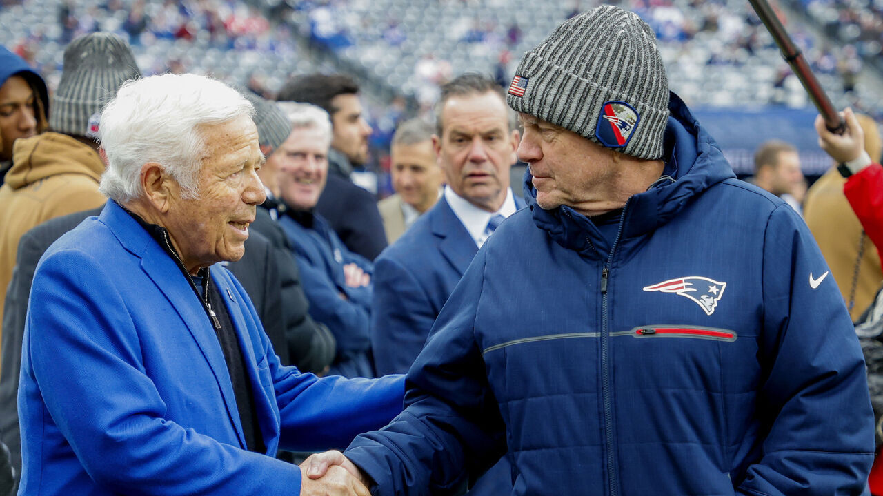 East Rutherford, NJ - November 26: New England Patriots head coach Bill Belichick shakes hands with owner Robert Kraft before the game. The Patriots lost to the New York Giants, 10-7.