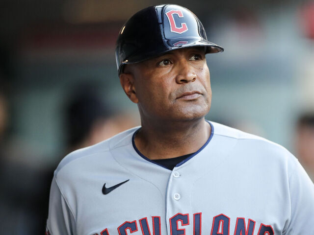 ANAHEIM, CALIFORNIA - SEPTEMBER 08: First base coach Sandy Alomar Jr. #15 of the Cleveland Guardians looks on from the dugout before the game against the Los Angeles Angels at Angel Stadium of Anaheim on September 08, 2023 in Anaheim, California.