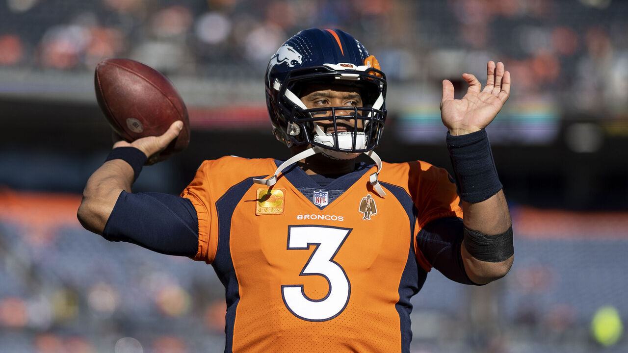 DENVER, COLORADO - NOVEMBER 26: Russell Wilson #3 of the Denver Broncos throws a pass as he warms up prior to an NFL football game between the Denver Broncos and the Cleveland Browns at Empower Field At Mile High on November 26, 2023 in Denver, Colorado.
