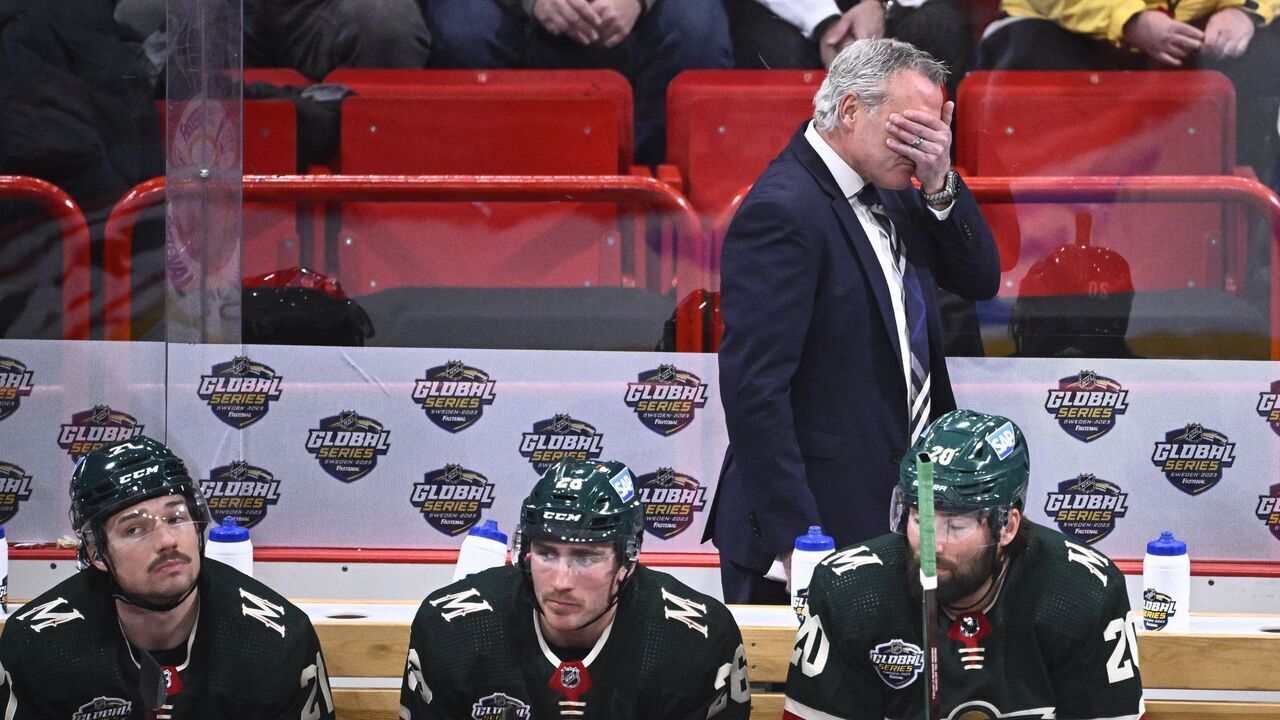 Minnesota's headcoach Dean Evason reacts as Minnesotas Brandon Duhaime (L-R), Connor Dewar and Pat Maroon look on during the NHL Global Series Sweden ice hockey match between Toronto Maple Leafs and Minnesota Wild at Avicii Arena in Stockholm, Sweden, on November 19, 2023.