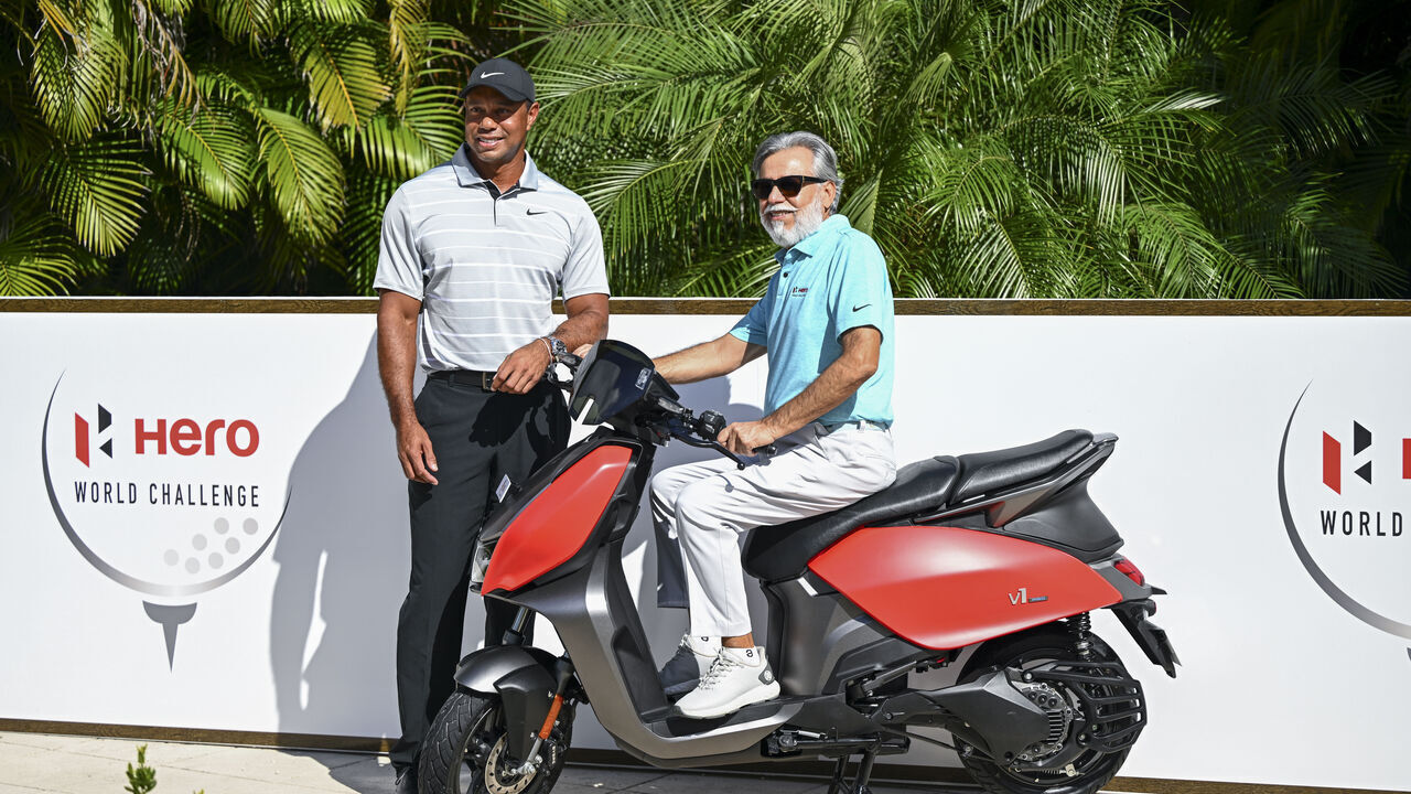 NASSAU, BAHAMAS - NOVEMBER 28: Tiger Woods poses with Dr. Pawan Munjal of India The Chairman, Managing Director and CEO of The Hero MotoCorp prior to the Hero World Challenge at Albany on November 28, 2023 in Nassau, New Providence, Bahamas.