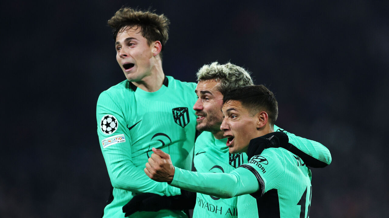 ROTTERDAM, NETHERLANDS - NOVEMBER 28: Rodrigo Riquelme, Antoine Griezmann and Nahuel Molina of Atletico Madrid celebrate the teams third goal after Santiago Gimenez of Feyenoord (not pictured) scores a own goal during the UEFA Champions League Group E match between Feyenoord Rotterdam and Club Atletico de Madrid at Feyenoord Stadium on November 28, 2023 in Rotterdam, Netherlands.