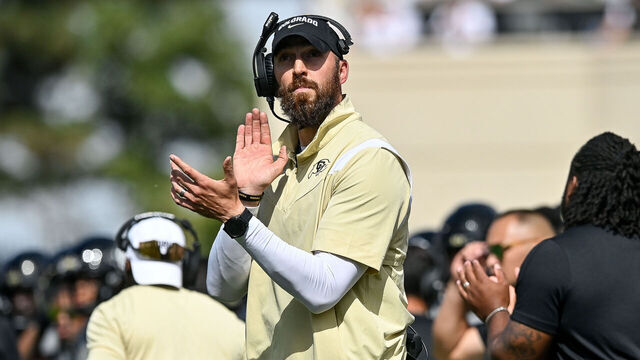 BOULDER, CO - SEPTEMBER 30: Offensive coordinator Sean Lewis claps after an offensive touchdown in the fourth quarter against the USC Trojans at Folsom Field on September 30, 2023 in Boulder, Colorado.