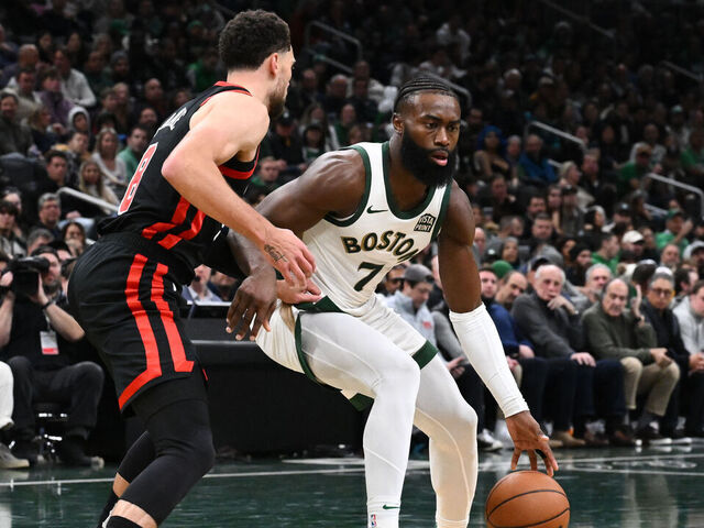 BOSTON, MASSACHUSETTS - NOVEMBER 28: Jaylen Brown #7 of the Boston Celtics drives to the basket against Zach LaVine #8 of the Chicago Bulls during the second quarter of an NBA In-Season Tournament game at the TD Garden on November 28, 2023 in Boston, Massachusetts.