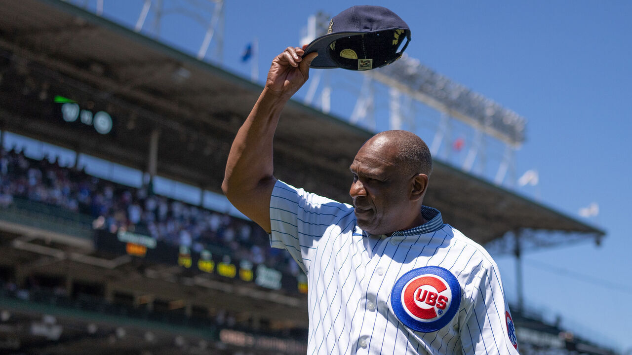 CHICAGO, IL - AUGUST 10: Major League Baseball Hall of Fame member, Andre Dawson, of the Chicago Cubs, tips his hat to the crowd before a game against the Washington Nationals at Wrigley Field on August 10, 2022 in Chicago, Illinois.