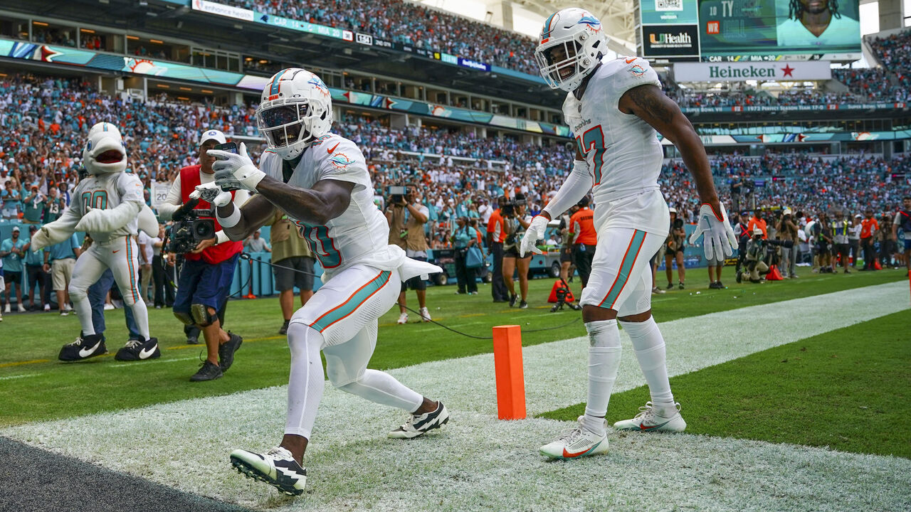 MIAMI GARDENS, FLORIDA - OCTOBER 15: Tyreek Hill #10 of the Miami Dolphins celebrates scoring a touchdown against the Carolina Panthers during the second quarter at Hard Rock Stadium on October 15, 2023 in Miami Gardens, Florida.