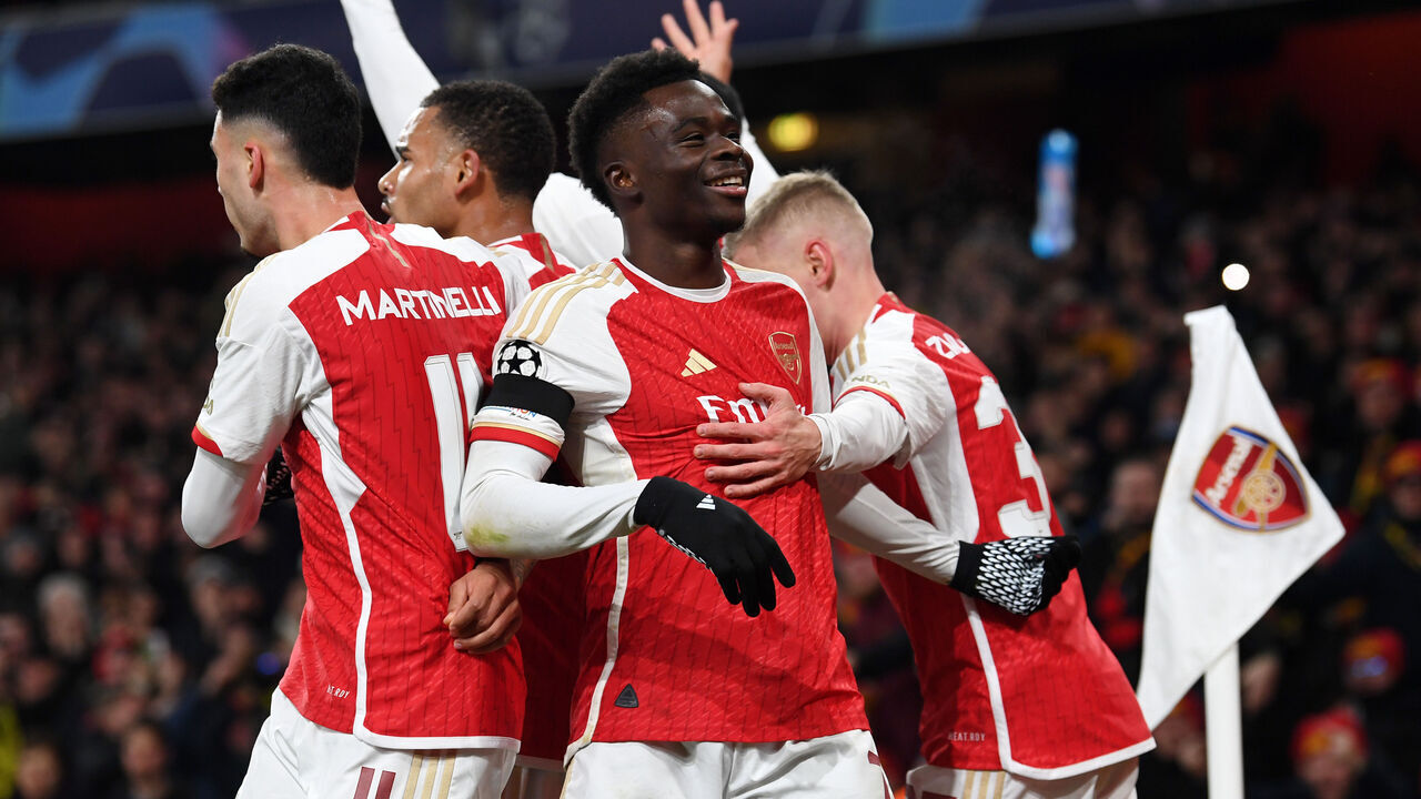 LONDON, ENGLAND - NOVEMBER 29: Bukayo Saka of Arsenal celebrates after teammate Gabriel Jesus (not pictured) scored the team's second goal during the UEFA Champions League match between Arsenal FC and RC Lens at Emirates Stadium on November 29, 2023 in London, England.