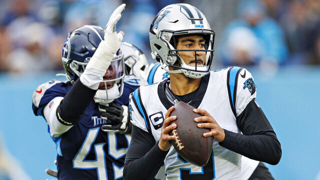 NASHVILLE, TENNESSEE - NOVEMBER 26: Bryce Young #9 of the Carolina Panthers drops back to pass under pressure from Arden Key #49 of the Tennessee Titans at Nissan Stadium on November 26, 2023 in Nashville, Tennessee. The Titans defeated the Panthers 17-10.
