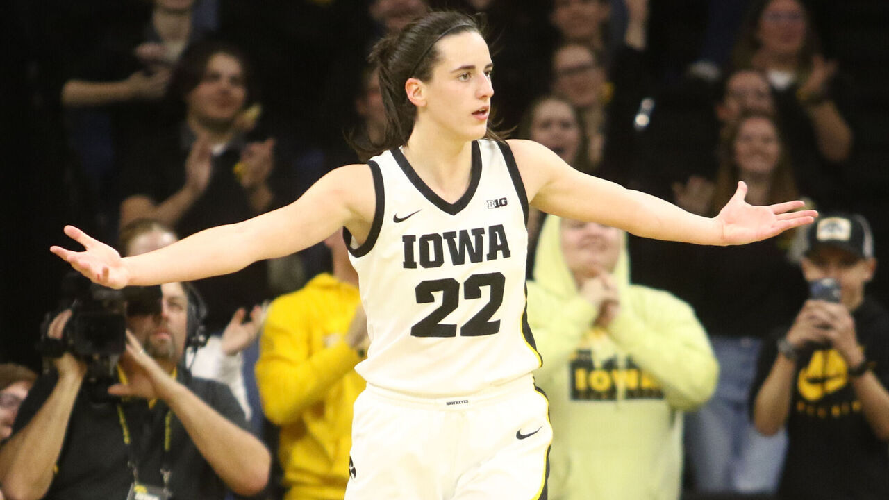 IOWA CITY, IOWA- NOVEMBER 19: Guard Caitlin Clark #22 of the Iowa Hawkeyes gestures to the crowd after a basket during the second half against the Drake Bulldogs at Carver-Hawkeye Arena on November 19, 2023 in Iowa City, Iowa.