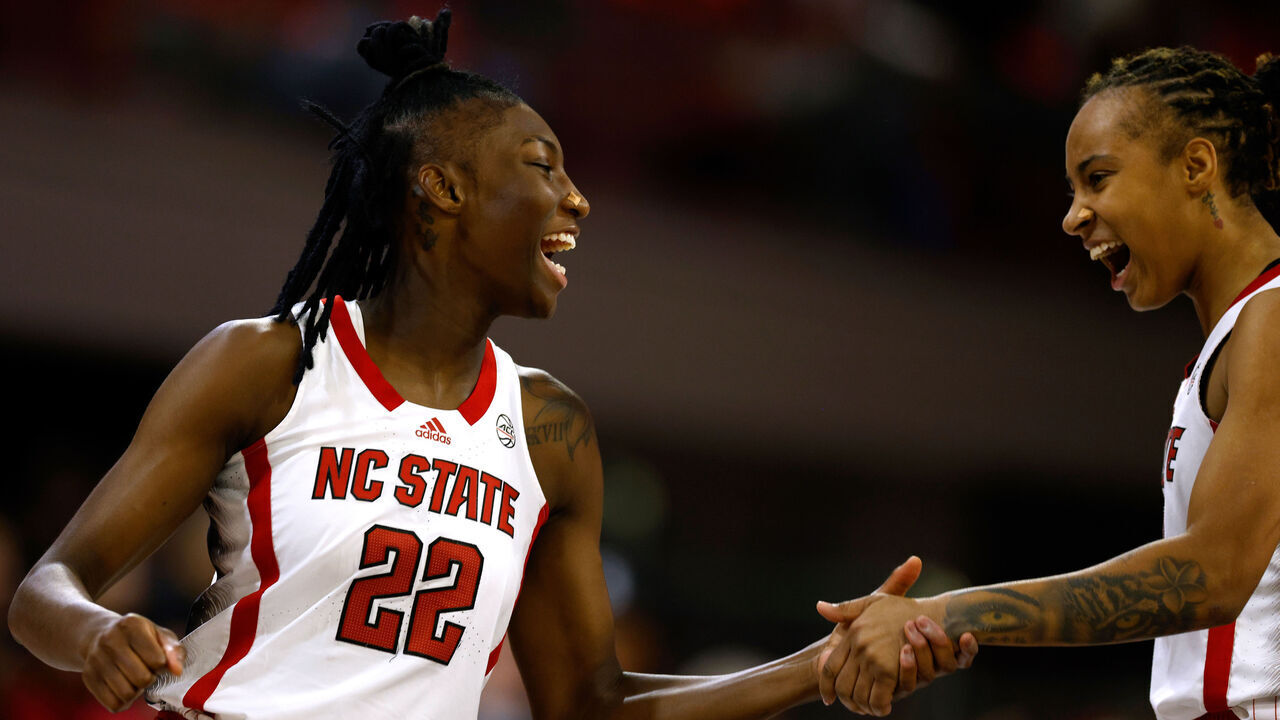 RALEIGH, NORTH CAROLINA - NOVEMBER 29: Saniya Rivers #22 and Aziaha James #10 of the NC State Wolfpack react during the second half of the game against the Vanderbilt Commodores at Reynolds Coliseum on November 29, 2023 in Raleigh, North Carolina. NC State won 70-62.