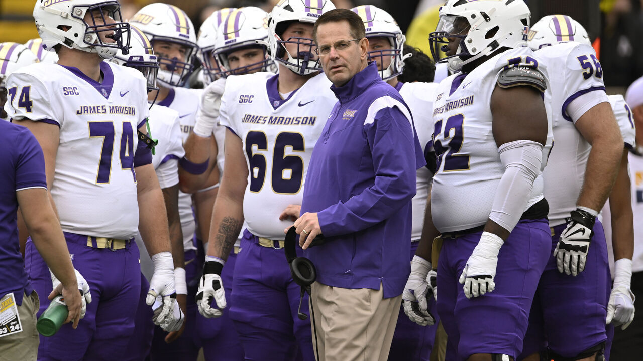 BOONE, NORTH CAROLINA - SEPTEMBER 24: Head coach Curt Cignetti of the James Madison Dukes stands with his team during a first quarter timeout against the Appalachian State Mountaineers at Kidd Brewer Stadium on September 24, 2022 in Boone, North Carolina.