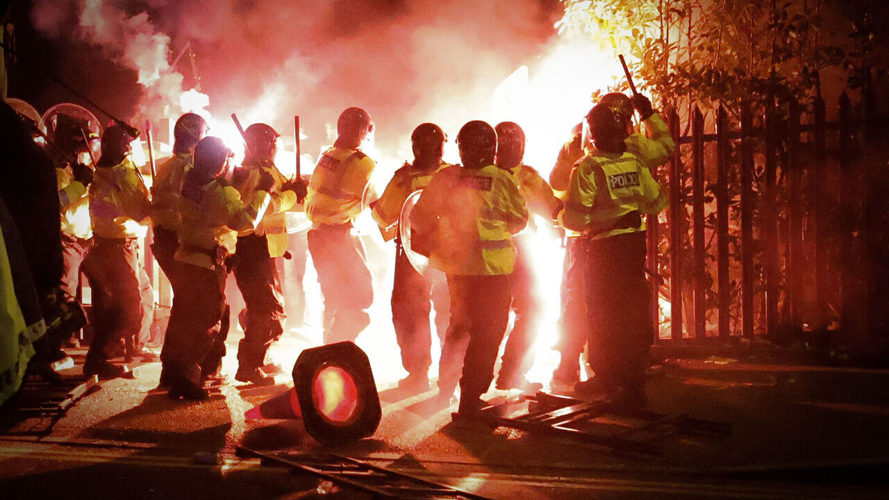 BIRMINGHAM, ENGLAND - NOVEMBER 30: Police clash with Legia Warszawa fans outside the stadium before the UEFA Europa Conference League match between Aston Villa and Legia Warszawa at Villa Park on November 30, 2023 in Birmingham, England.
