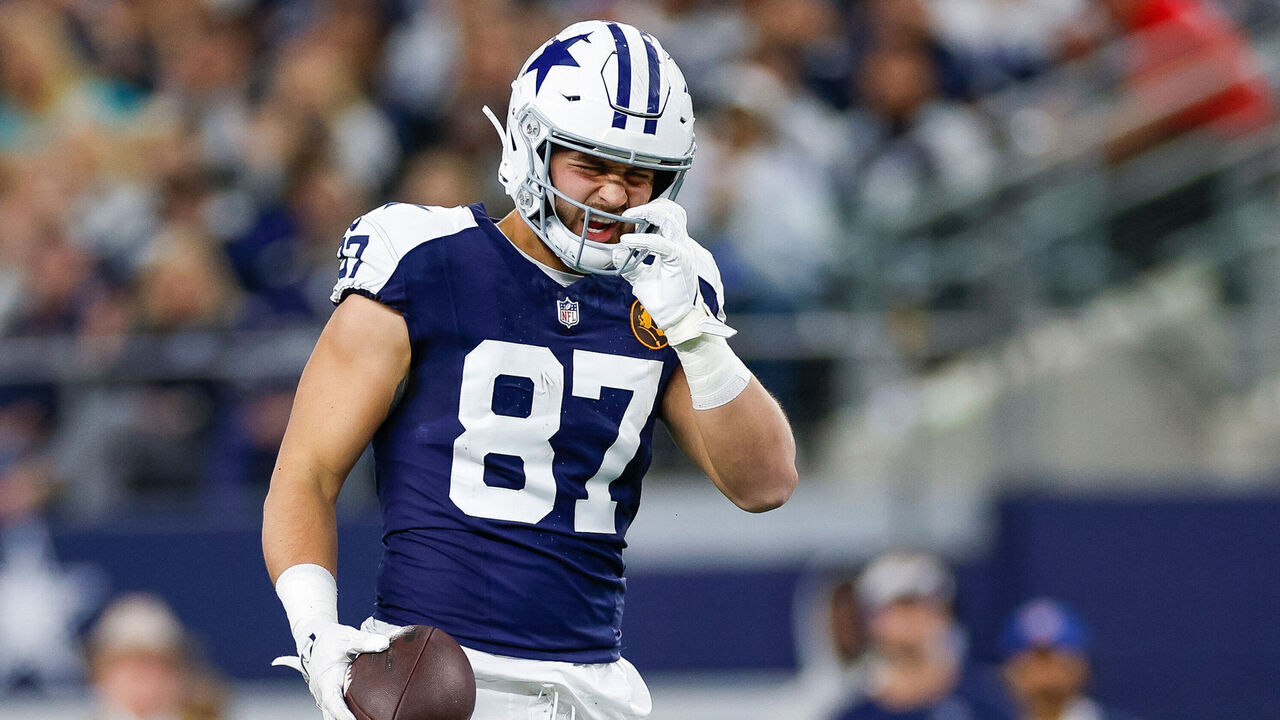ARLINGTON, TEXAS - NOVEMBER 23: Jake Ferguson #87 of the Dallas Cowboys reacts against the Washington Commanders during the first half at AT&T Stadium on November 23, 2023 in Arlington, Texas.
