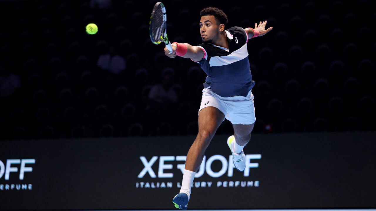 JEDDAH, SAUDI ARABIA - NOVEMBER 30: Arthur Fils of France plays a backhand to Dominic Stricker of Switzerland in the third round robin match during day three of the Next Gen ATP Finals at King Abdullah Sports City on November 30, 2023 in Jeddah, Saudi Arabia.