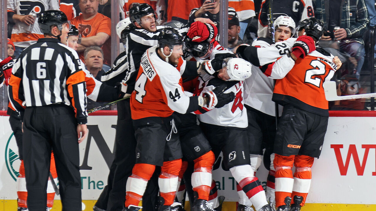 PHILADELPHIA, PENNSYLVANIA - NOVEMBER 30: A scrum erupts during the first period between Nicolas Deslauriers #44, Garnet Hathaway #19, Ryan Poehling #25 of the Philadelphia Flyers, and Curtis Lazar #42 and Michael McLeod #20 of the New Jersey Devils at the Wells Fargo Center on November 30, 2023 in Philadelphia, Pennsylvania.