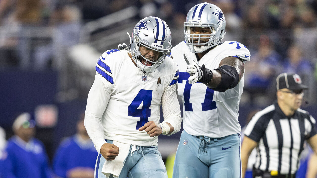 ARLINGTON, TEXAS - NOVEMBER 30: Dak Prescott #4 of the Dallas Cowboys celebrates after passing for a touchdown during an NFL football game between the Dallas Cowboys and the Seattle Seahawks at AT&T Stadium on November 30, 2023 in Arlington, Texas.