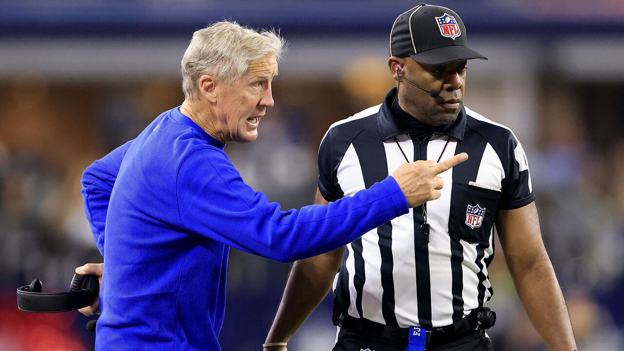 ARLINGTON, TEXAS - NOVEMBER 30: Head coach Pete Carroll of the Seattle Seahawks talks with a referee on the sidelines during the 2nd quarter of the game against the Dallas Cowboys at AT&T Stadium on November 30, 2023 in Arlington, Texas.