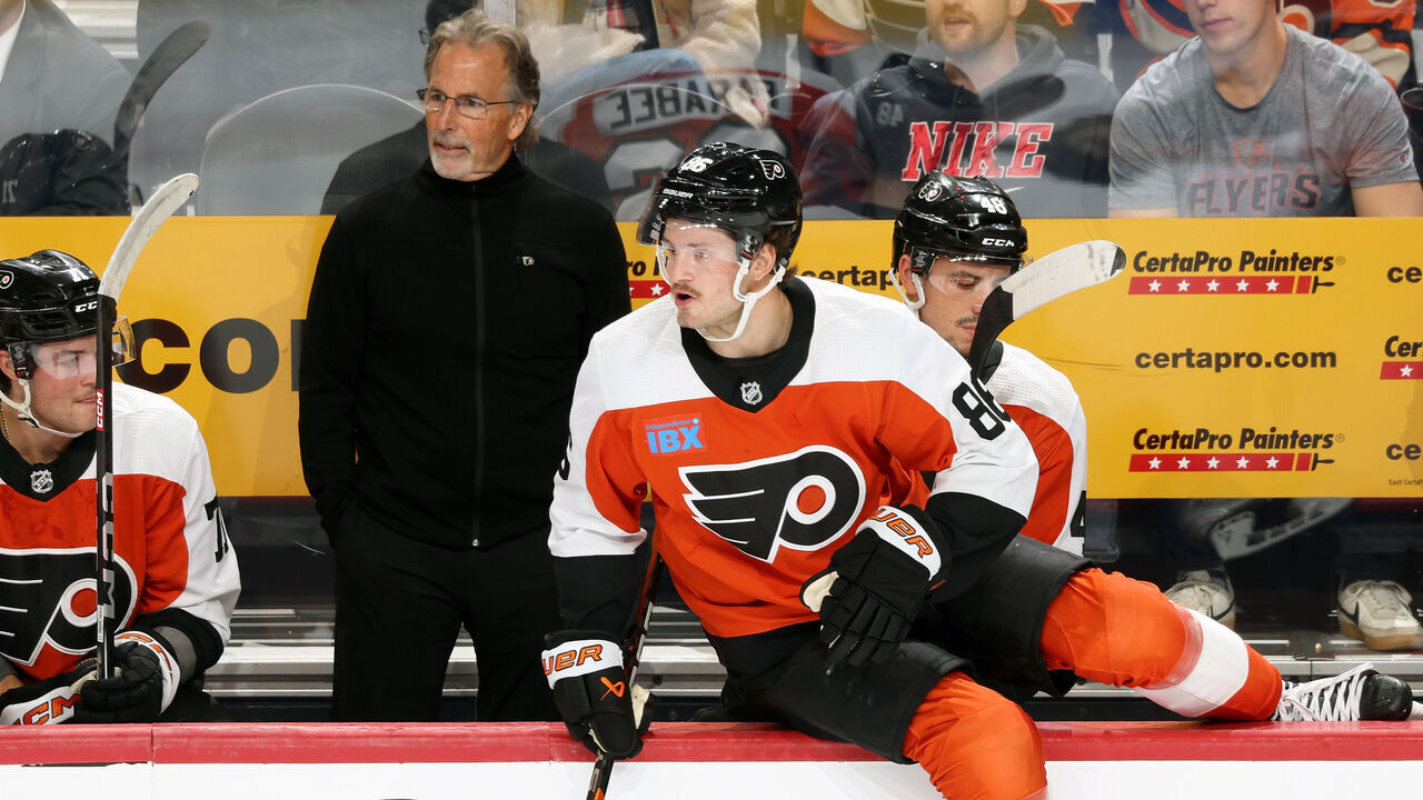 PHILADELPHIA, PENNSYLVANIA - NOVEMBER 01: Joel Farabee #86 of the Philadelphia Flyers jumps to the ice on a shift change as Tyson Foerster #71, Head Coach John Tortorella and Morgan Frost #48 look on against the Buffalo Sabres at the Wells Fargo Center on November 1, 2023 in Philadelphia, Pennsylvania.