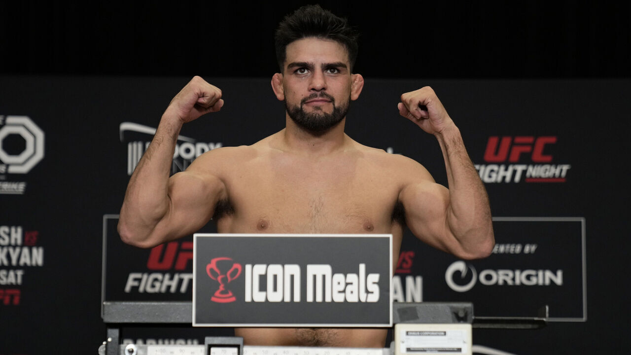 AUSTIN, TEXAS - DECEMBER 01: Kelvin Gastelum poses on the scale during the UFC Fight Night official weigh-in at the Hilton Austin on December 01, 2023 in Austin, Texas.